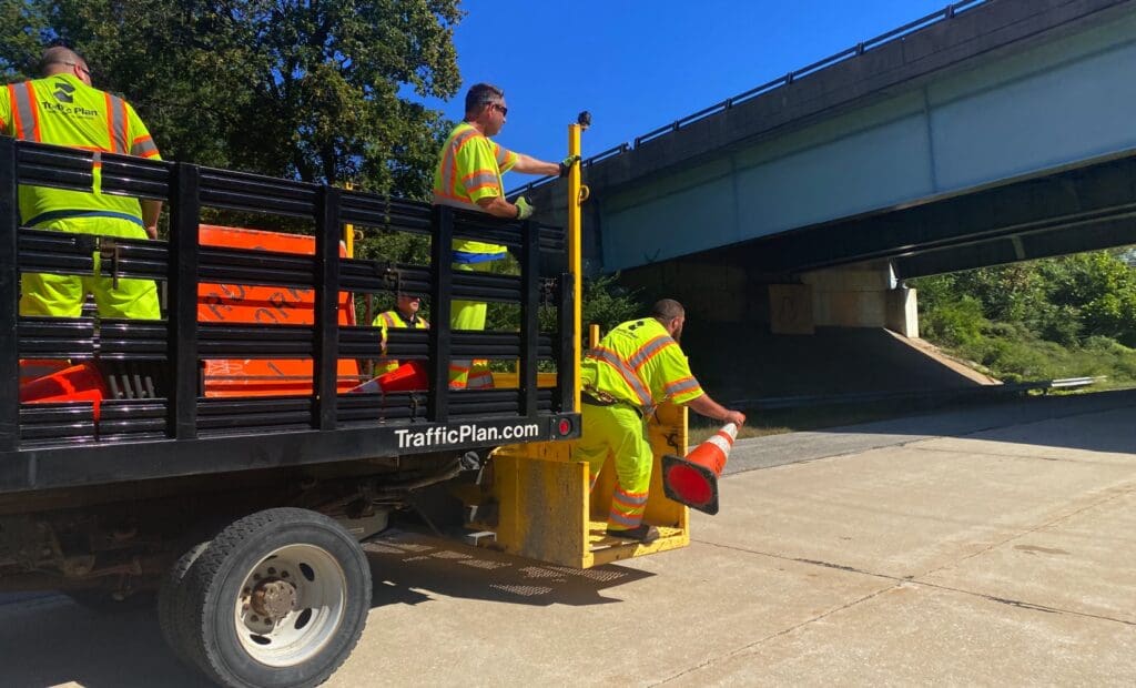 road flaggers in the back of a truck